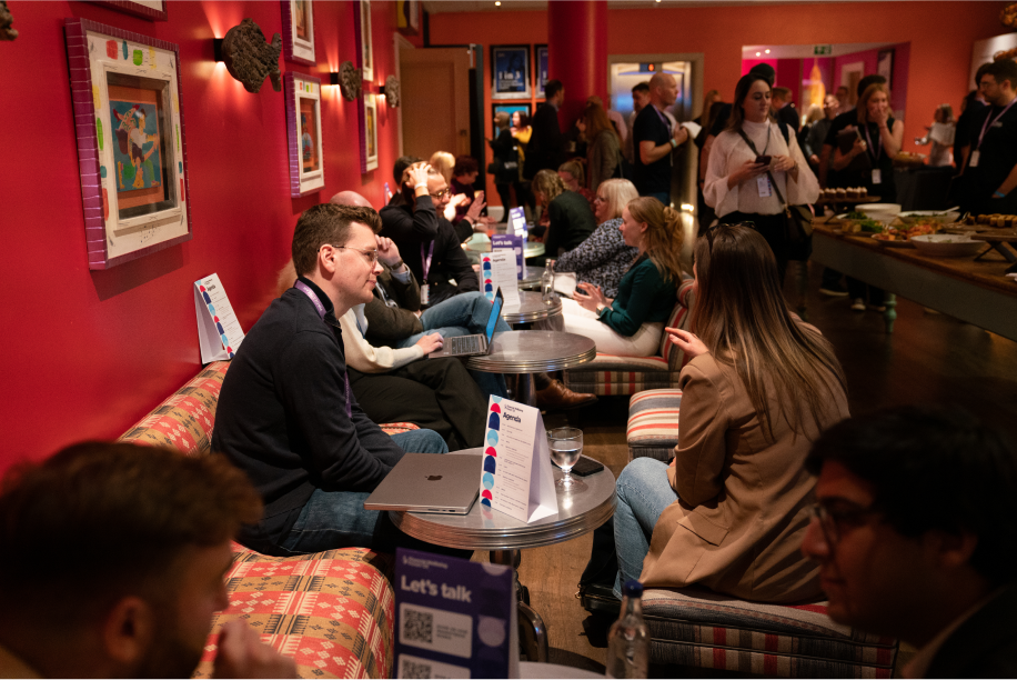 People networking and socializing at a Wagestream event.
