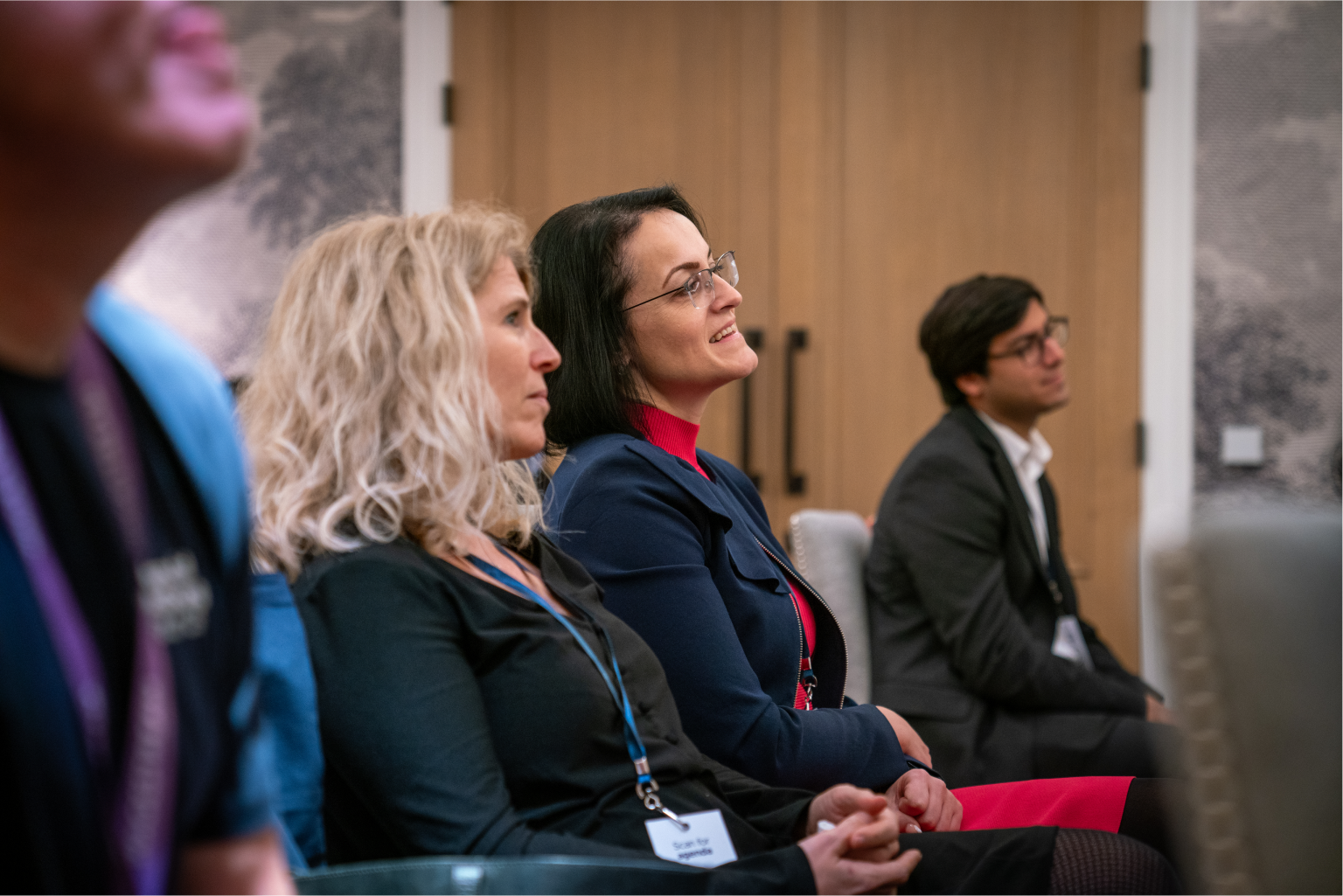 Attendees listen attentively during a Wagestream financial wellness workshop.
