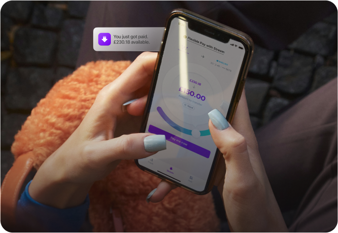 Person using Wagestream app on smartphone to transfer £150.00 of earned wages.
